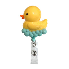 Porta tijeras / ID retráctil con pinza metálica, pato